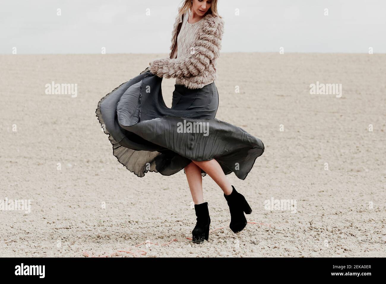 Woman wearing skirt dancing hi-res stock photography and images