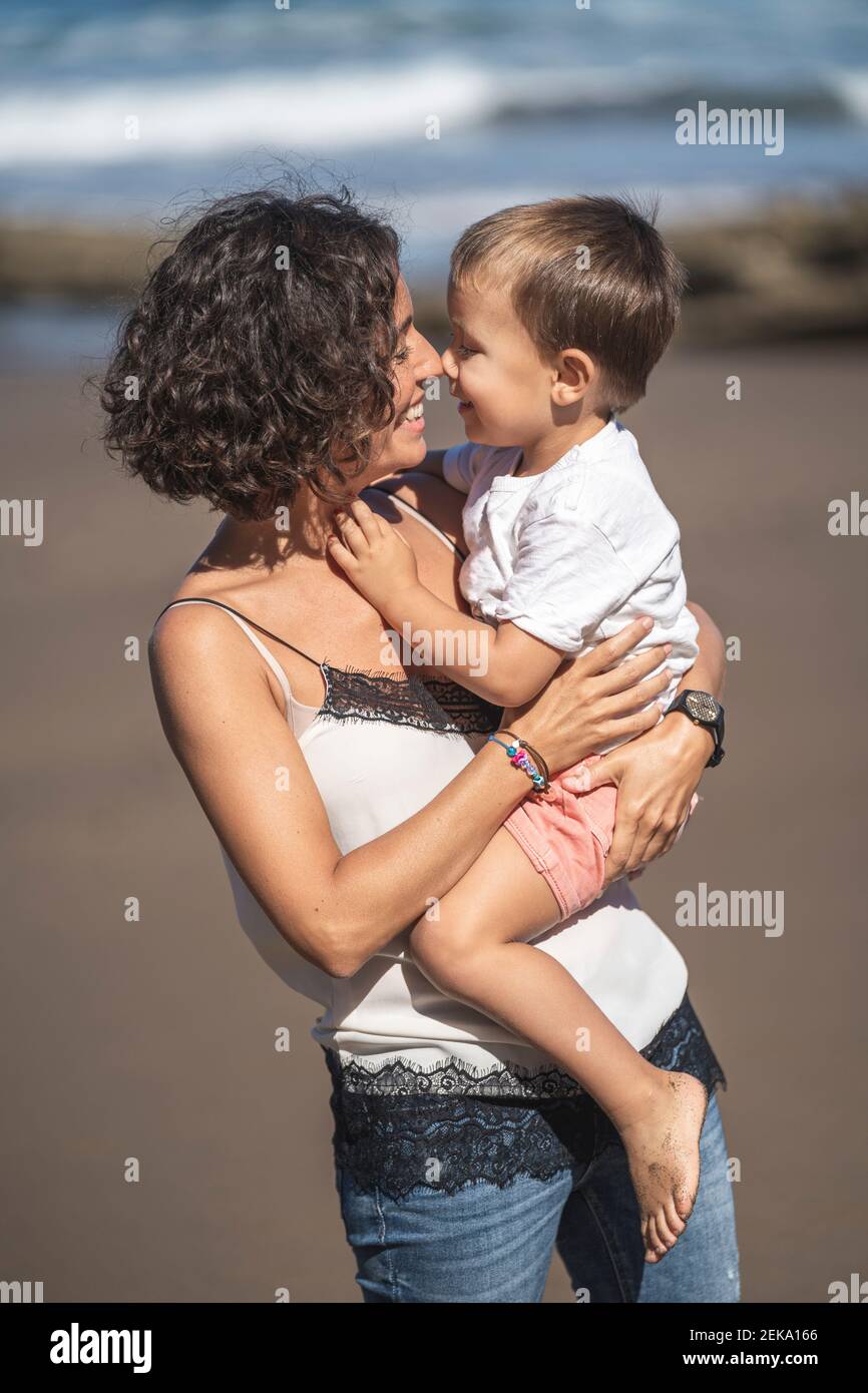 Mother son smiling beach hi-res stock photography and images - Alamy