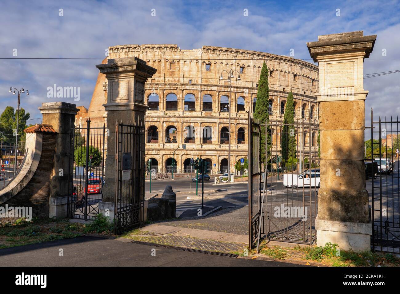 Italy, Rome, Colosseum, Oppian Hill Park gate and ancient amphitheatre Stock Photo