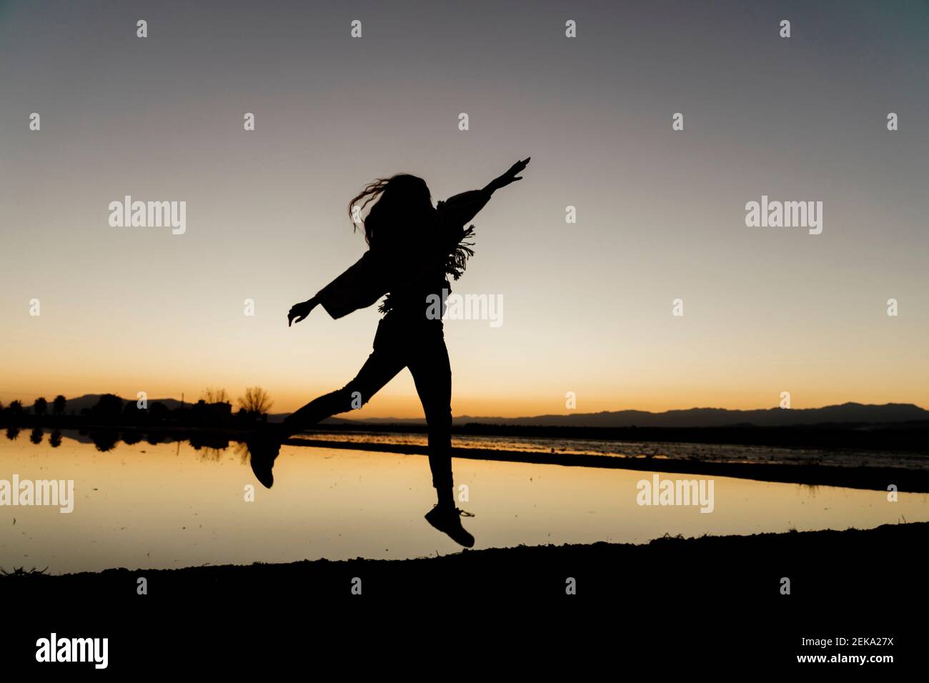 Silhouette woman raised arms hi-res stock photography and images - Alamy