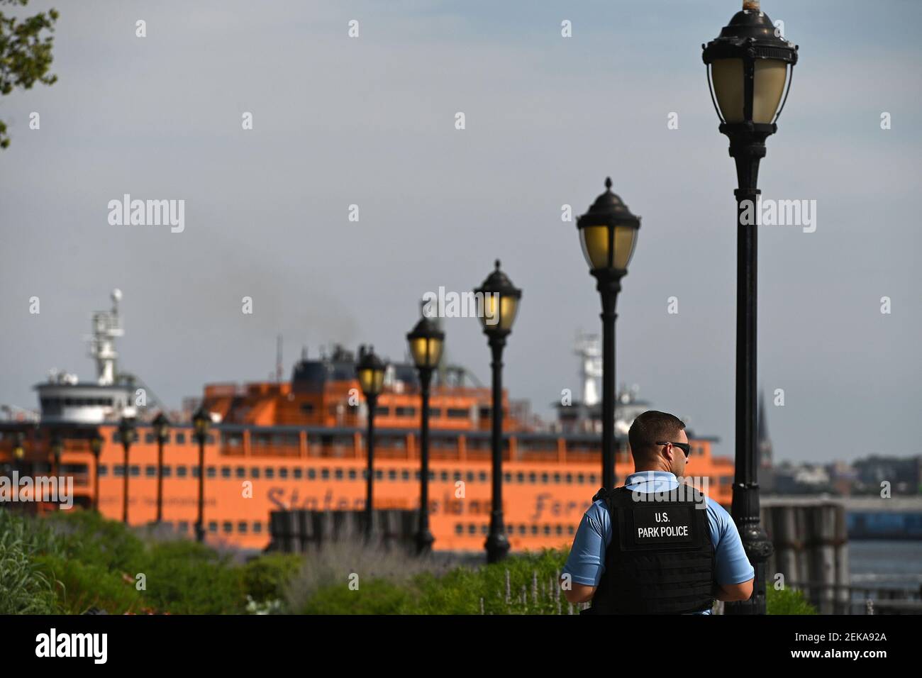 A U.S. Park Police Officer waits for the Liberty Island Park ferry boat