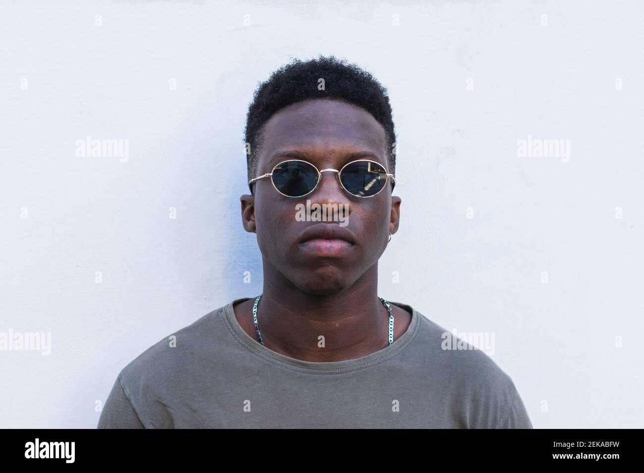 Free Photo | Handsome black young hipster wearing stylish hat and mirrored  lens round sunglasses admiring beautiful and happy moments of his journey  in foreign country while traveling alone around the world