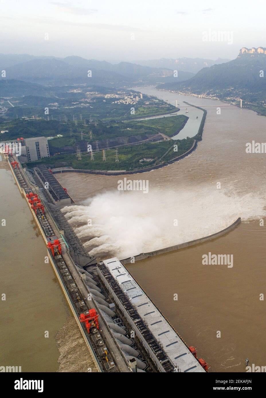 An aerial view of the Three Gorges Dam opens floodgate to discharge the second flood on the Yangtze River of the year, Yichang city, central China's Hubei province, 19 July 2020. Stock Photo