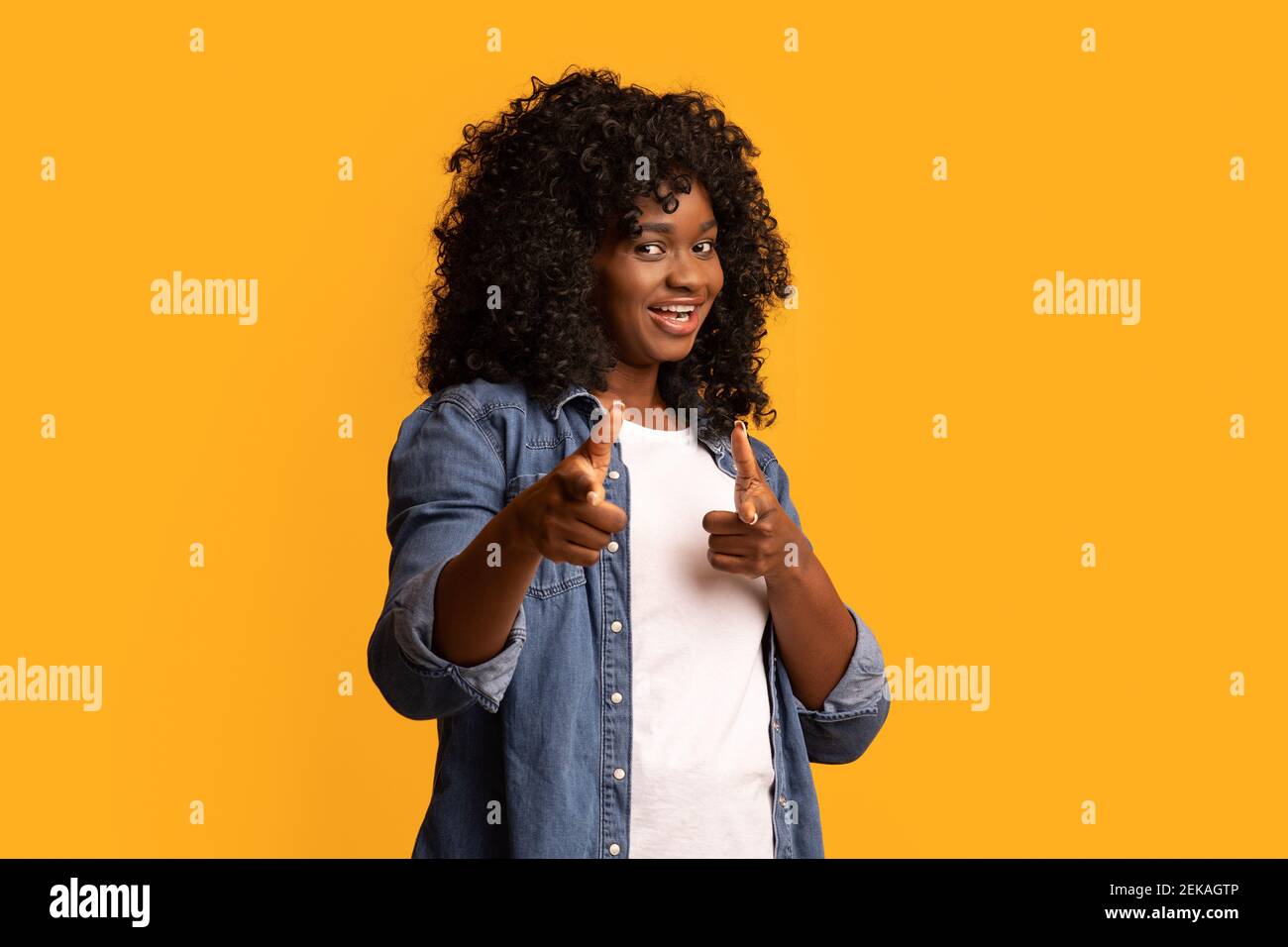 Happy black woman indicating hi-res stock photography and images - Alamy
