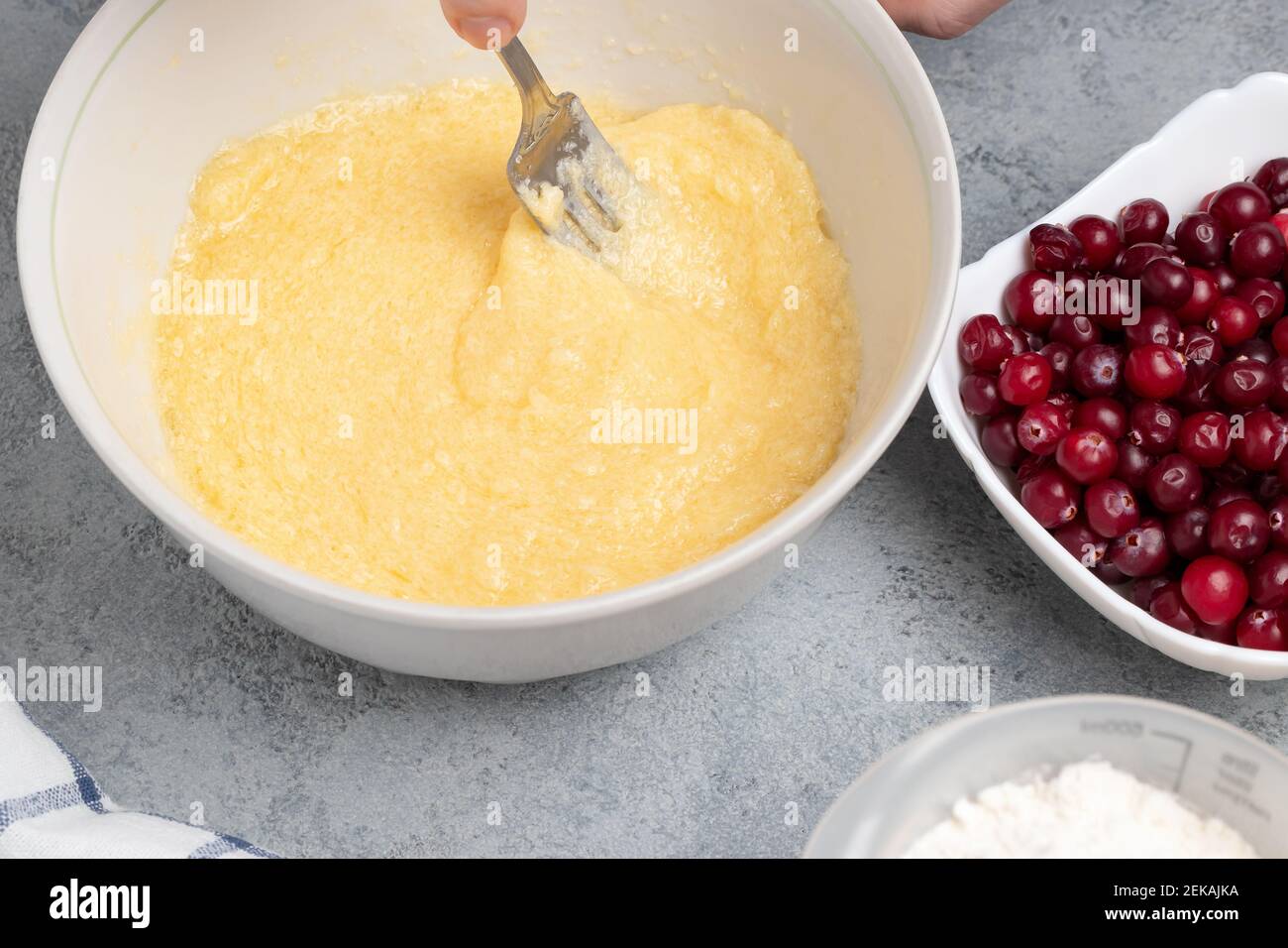 Making a dough for a sweet cranberry pie. Mixing butter and sugar. Stock Photo