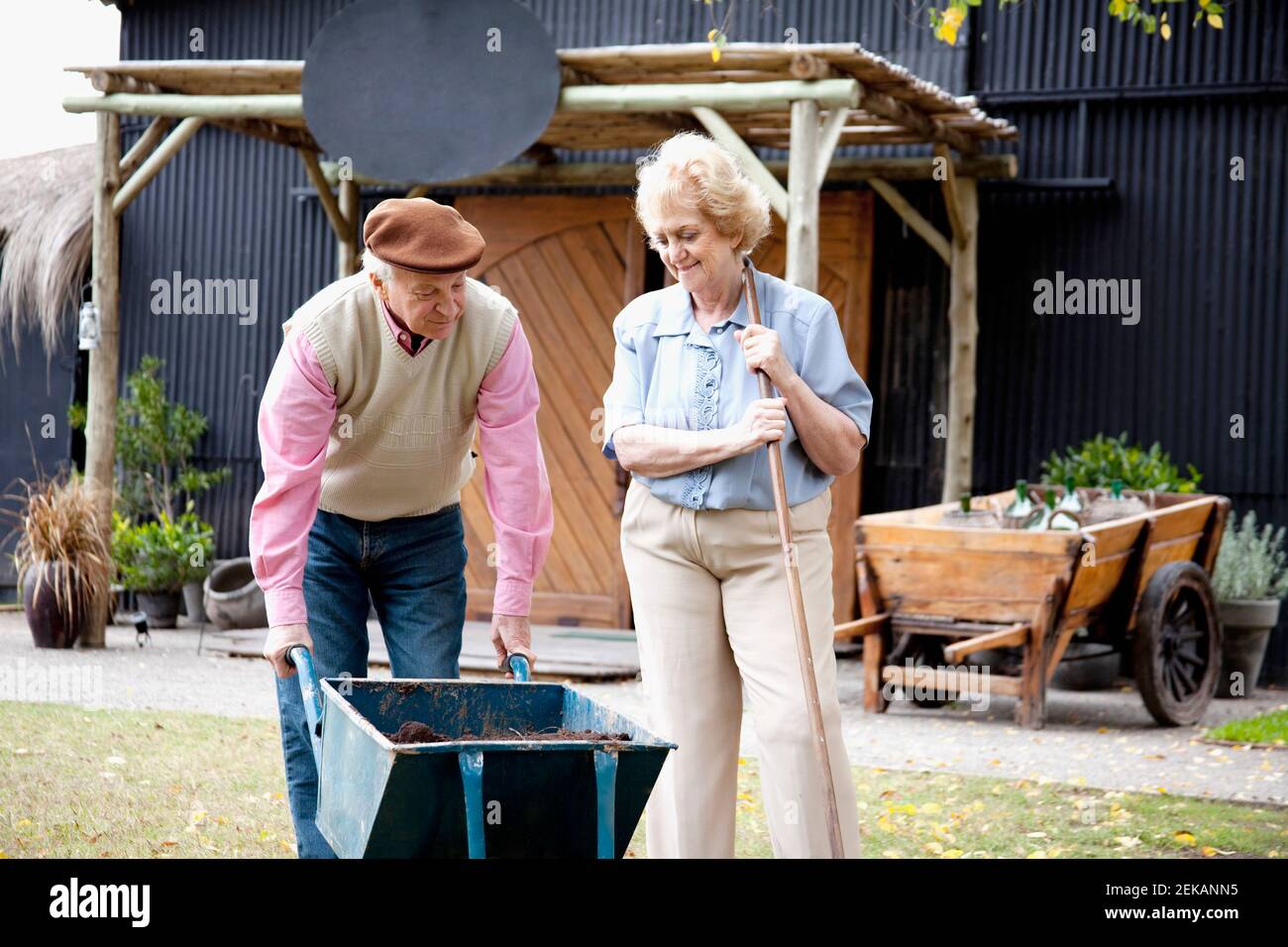 Couple gardening in a lawn Stock Photo