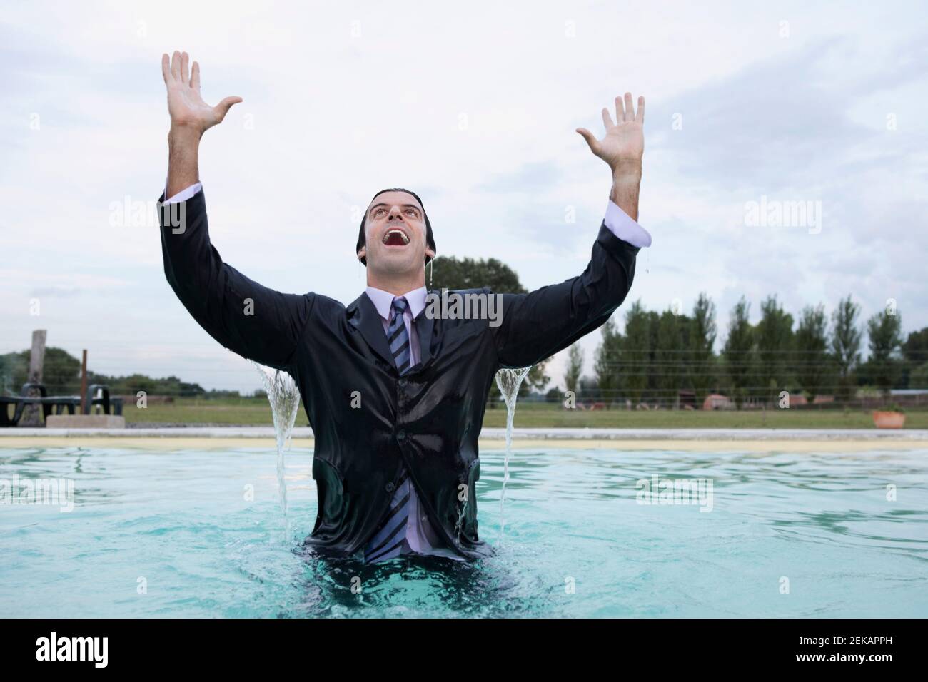 Businessman in a swimming pool Stock Photo