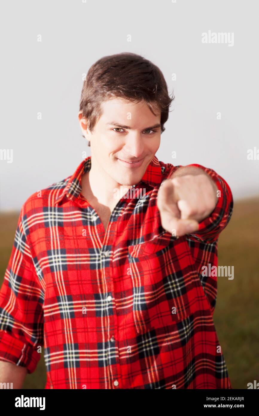 Portrait of a man pointing forward Stock Photo