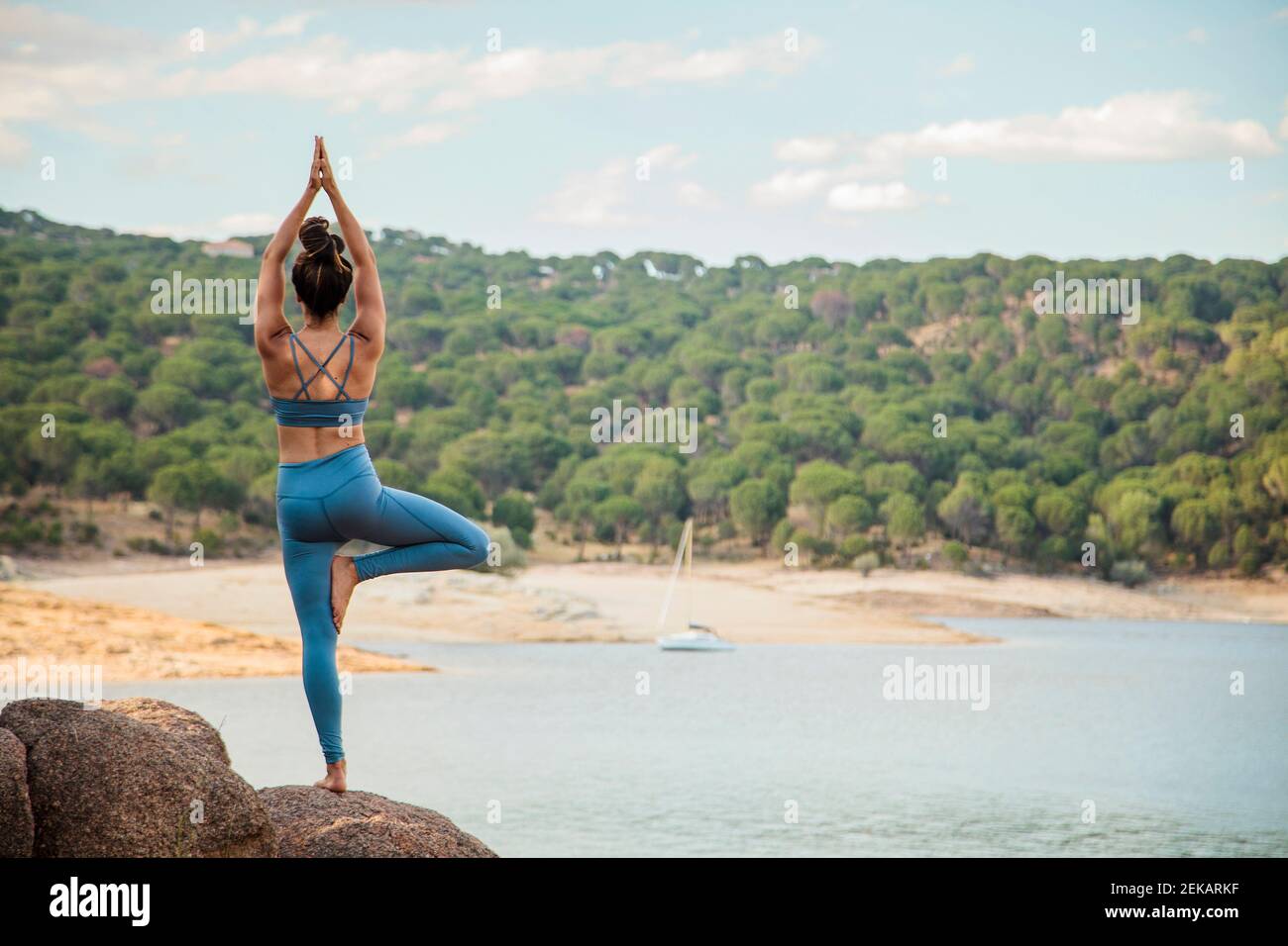 Young woman practicing tree pose Stock Photo