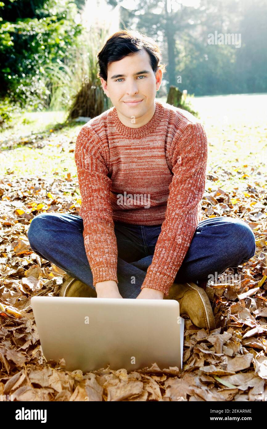 Portrait of a man using a laptop Stock Photo - Alamy