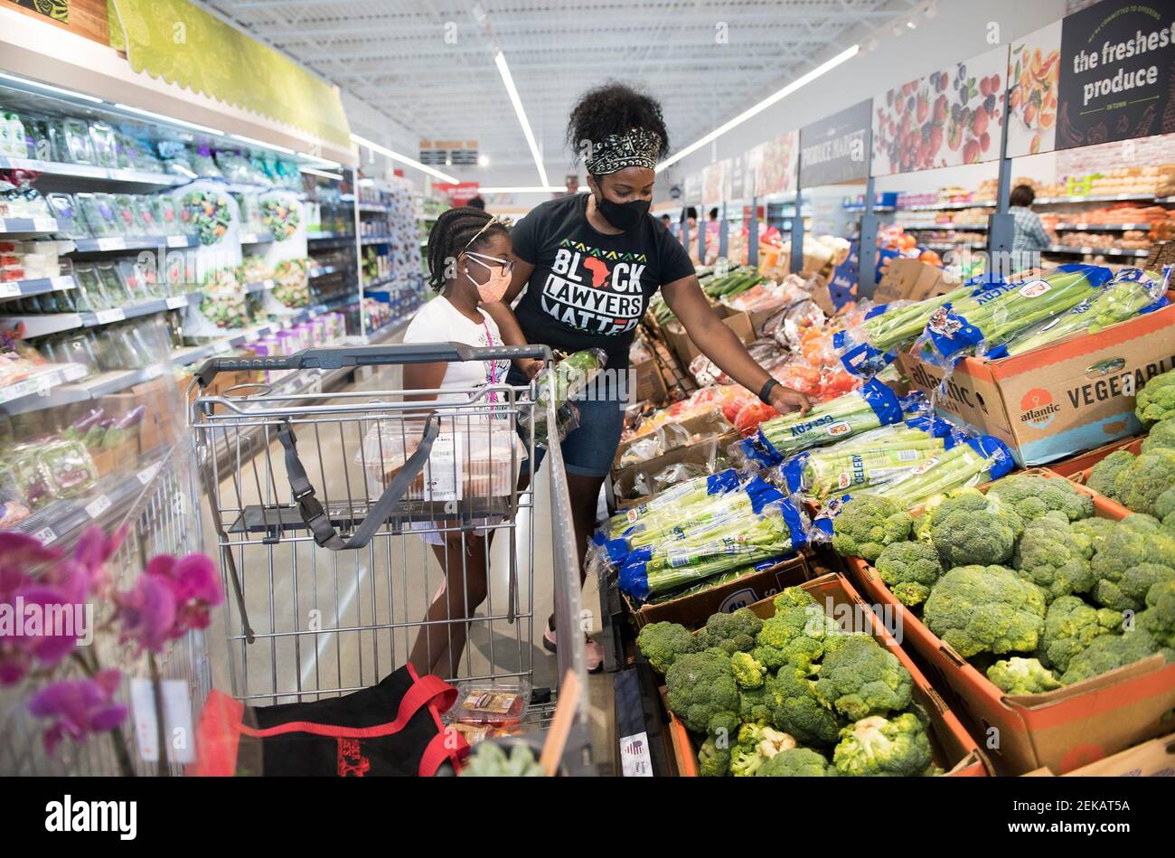 Talaya Diggs and her 10-year-old daughter Gabriella Diggs of Edgewater Park  shop for produce at the new Lidi in Burlington Township, NJ on Wednesday,  July 22, 2020. The food market celebrated its