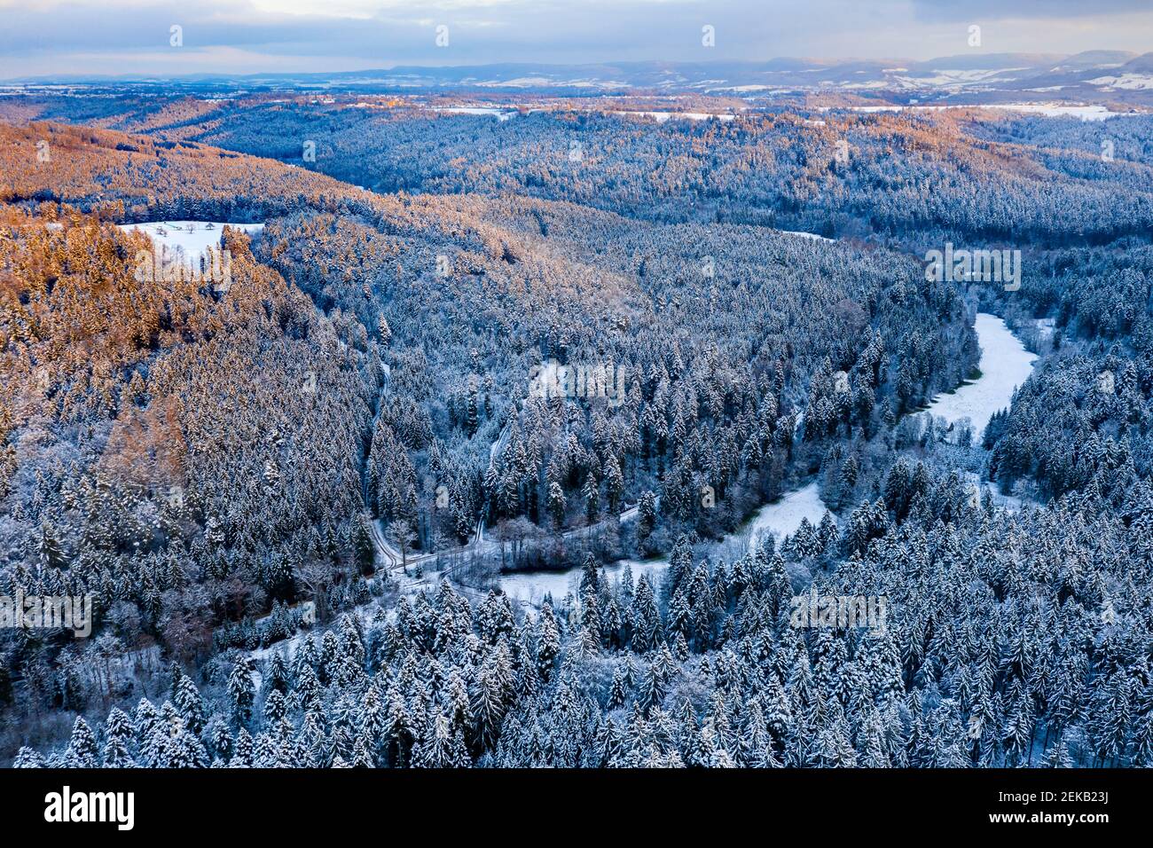 Drone view of forested Remstal valley at winter dusk Stock Photo