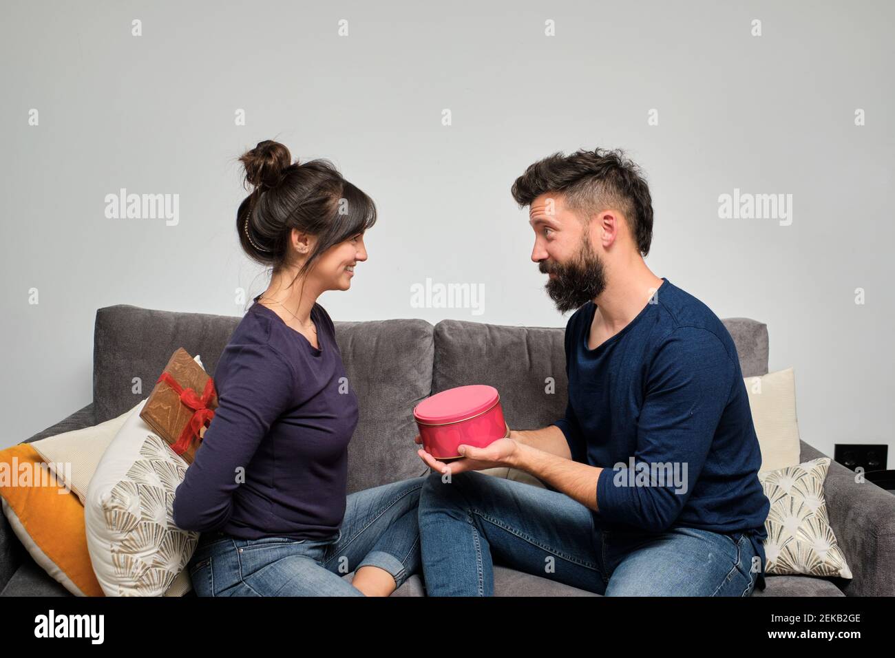 Adult couple exchanging gifts on Valentines Day Stock Photo