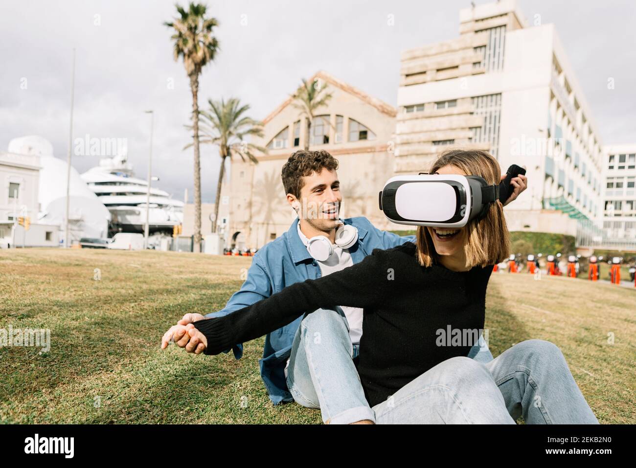 Couple using virtual reality goggles in city Stock Photo