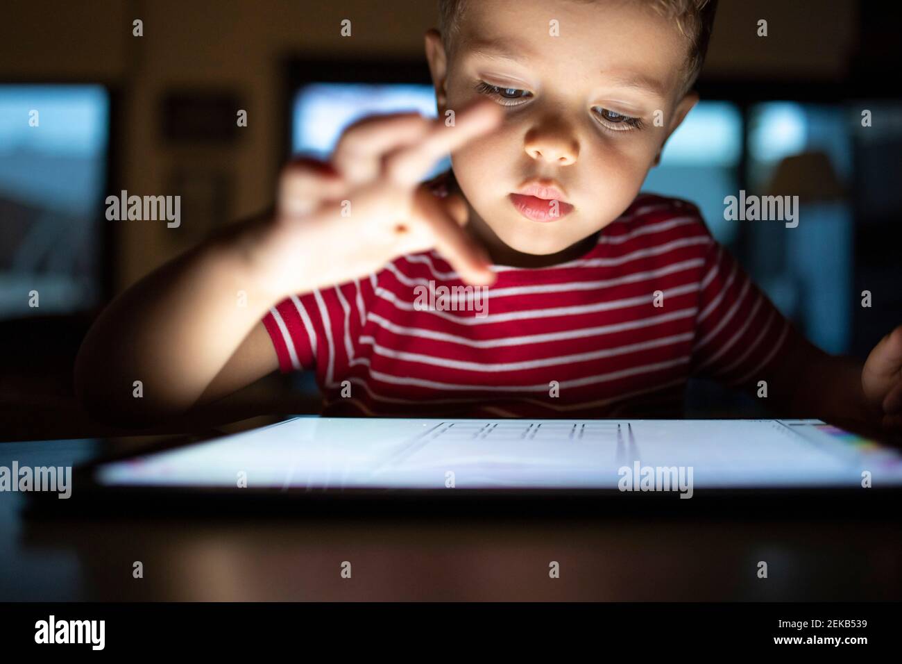 Cute boy using digital tablet at home Stock Photo