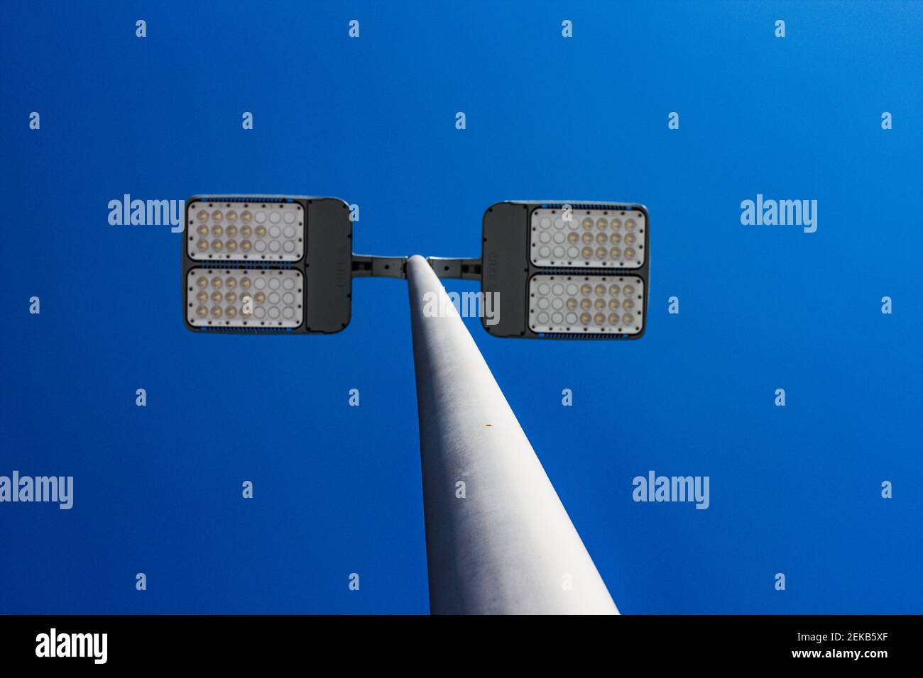 Light Pole Against Blue Sky Stock Photo - Alamy