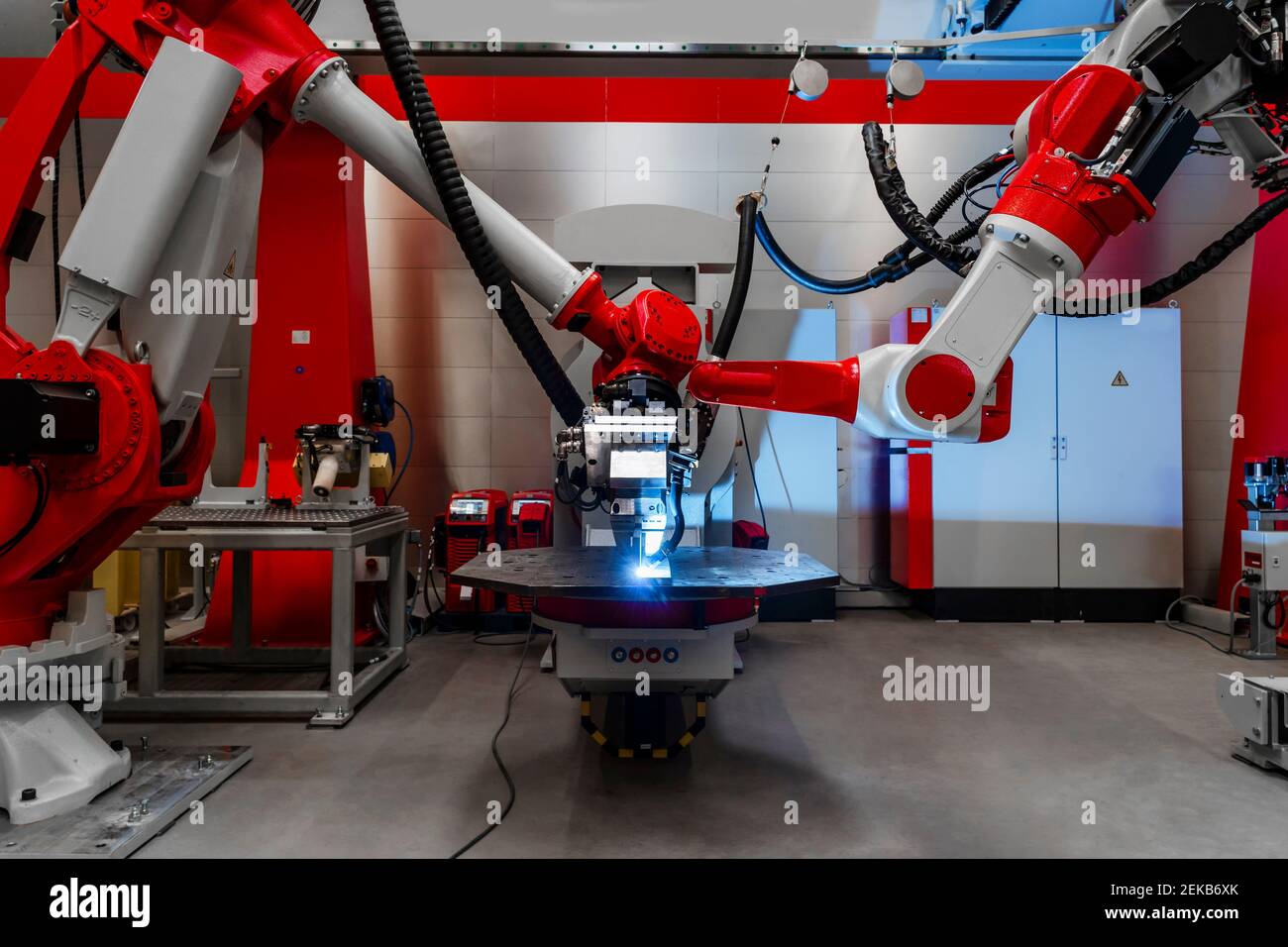 Automatic robots welding metal in factory Stock Photo