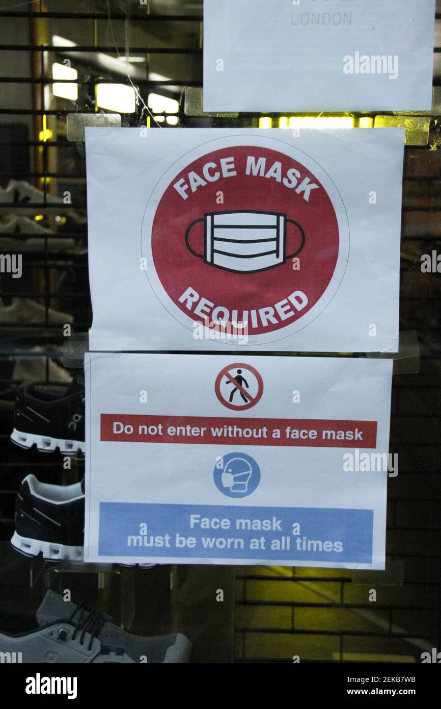 A sign outside a shop in Bricklane reminds customers to wear a face mask. The Government has made it mandatory to wear face coverings in all public transport, supermarkets and indoor shopping centers as a measure to combat the spread of the novel coronavirus. (Photo by David Mbiyu / SOPA Images/Sipa USA)  Stock Photo