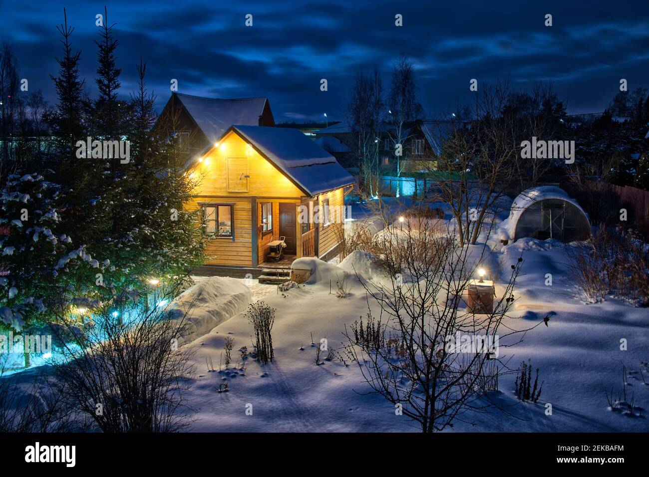 Snow-covered Dacha in a Winter Twilight Stock Photo