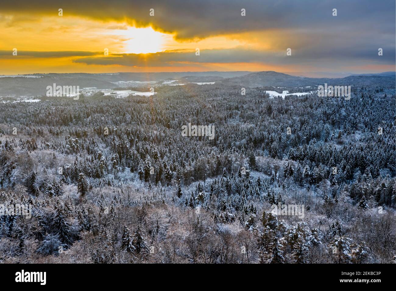 Drone view of forested Remstal valley at winter sunset Stock Photo