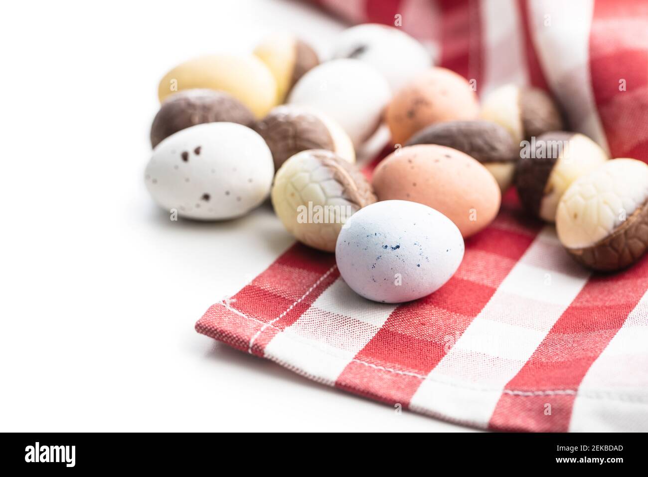 Chocolate easter eggs. Sweet candy eggs isolated on white background. Stock Photo