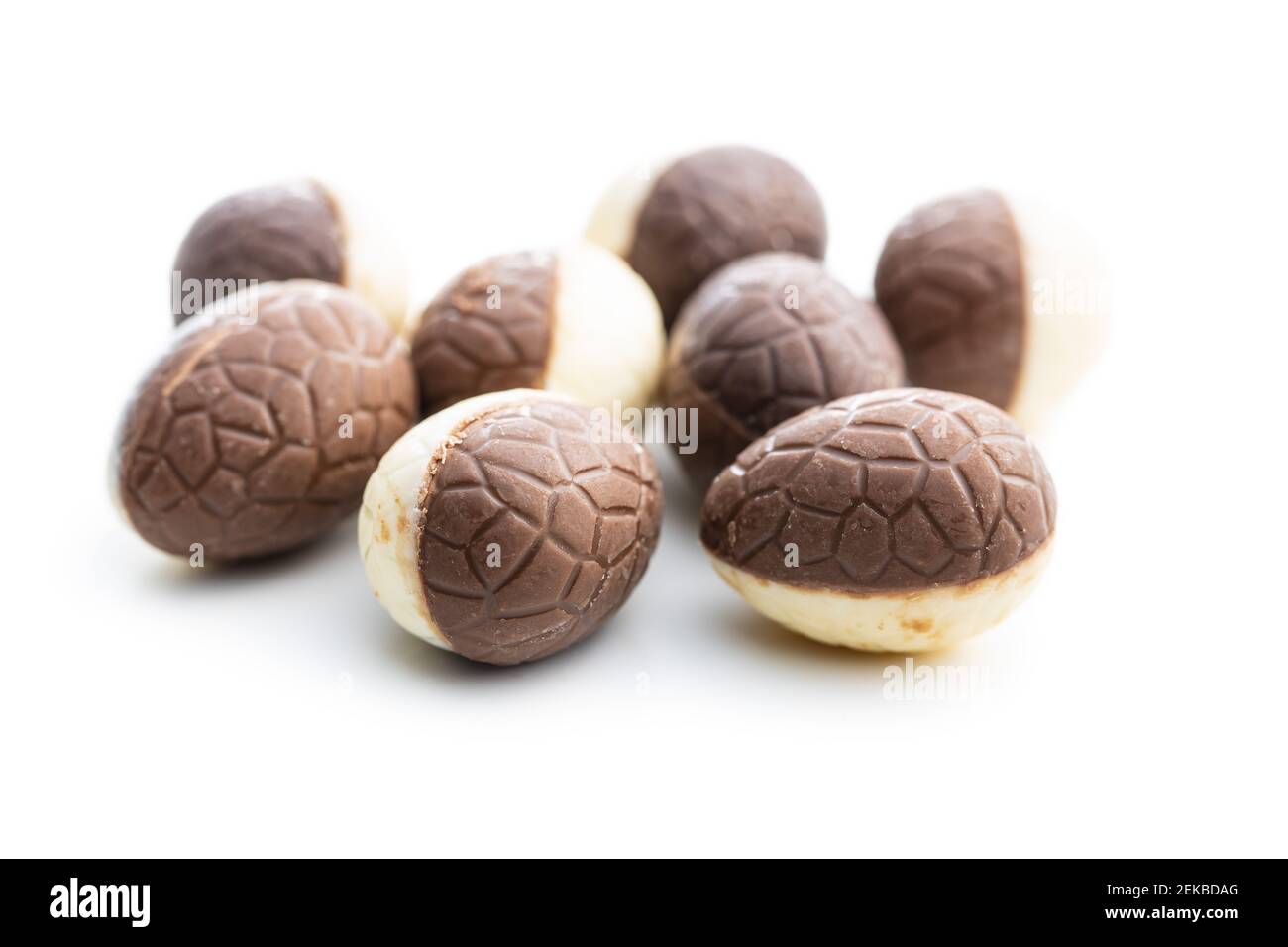 Chocolate easter eggs. Sweet candy eggs isolated on white background. Stock Photo