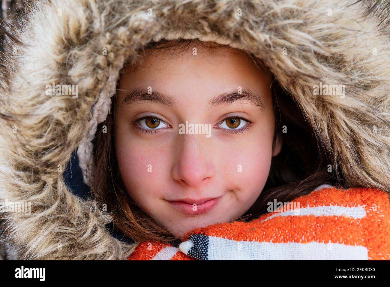 Close-up portrait of girl wearing fur coat Stock Photo - Alamy