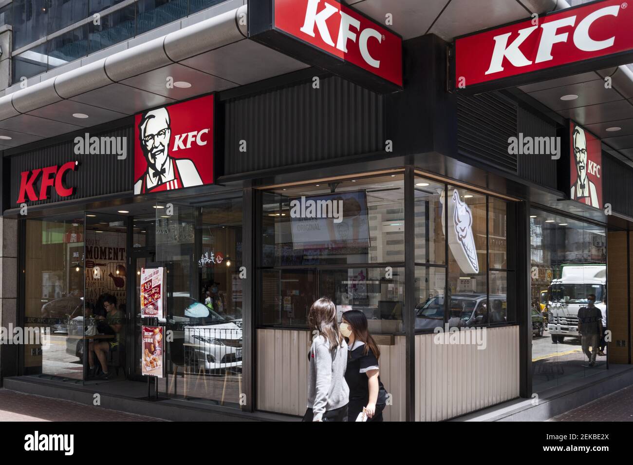 A Woman Walks Past The American Fast Food Chicken Restaurant Chain Kentucky Fried Chicken Kfc 2772