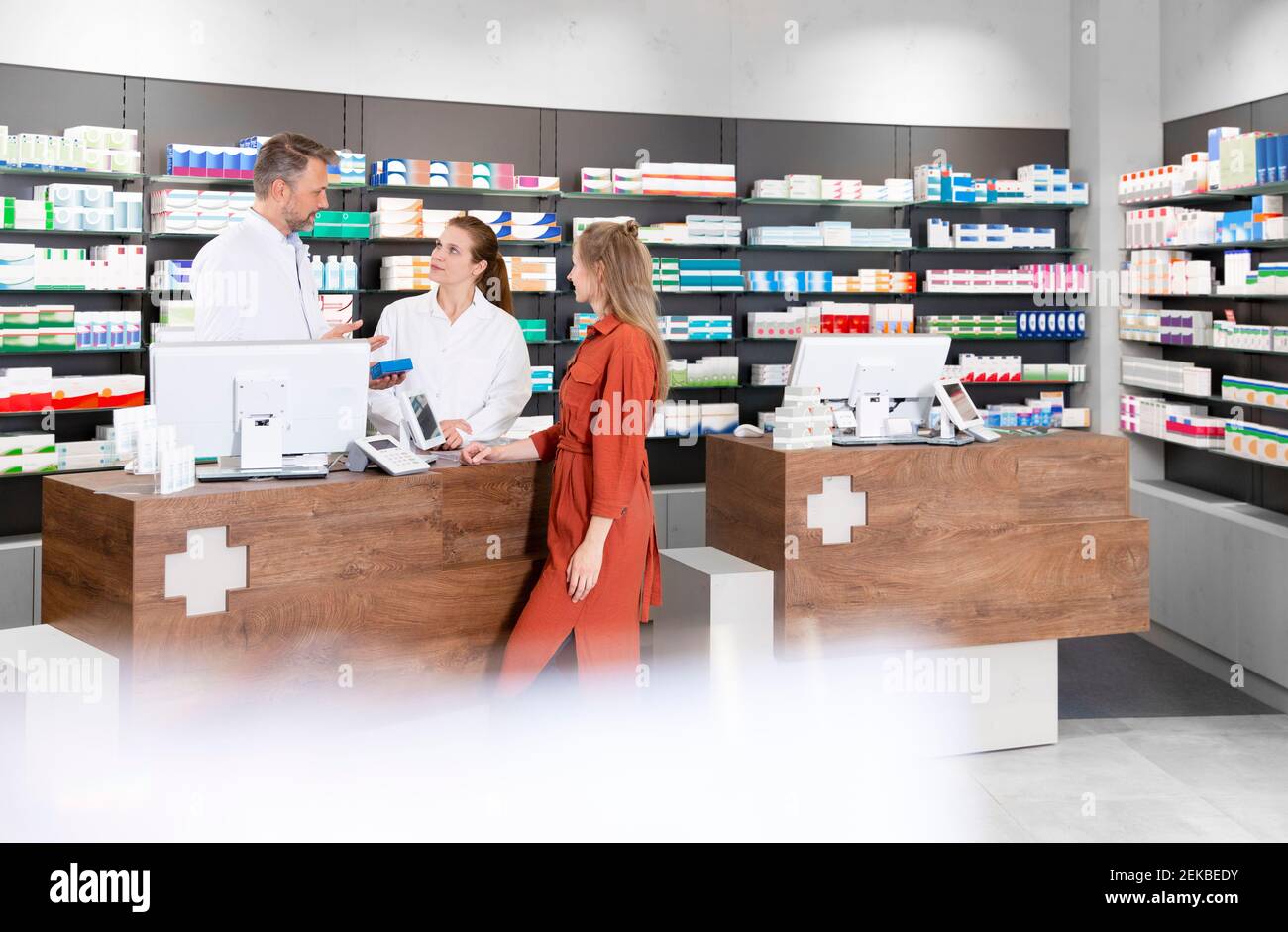 Customer collecting wholesale order at pharmacy counter