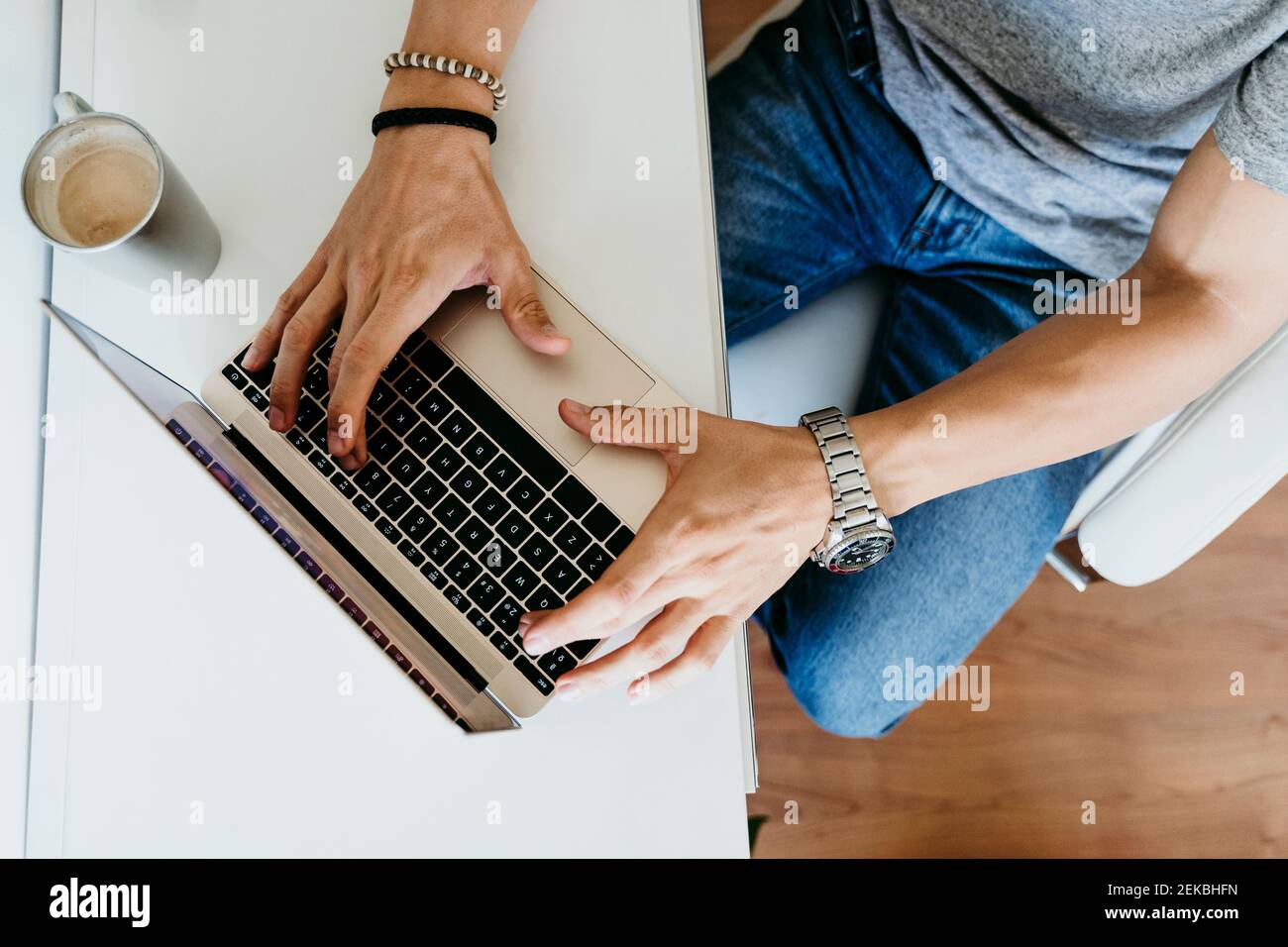 Top view of man working on laptop at home Stock Photo