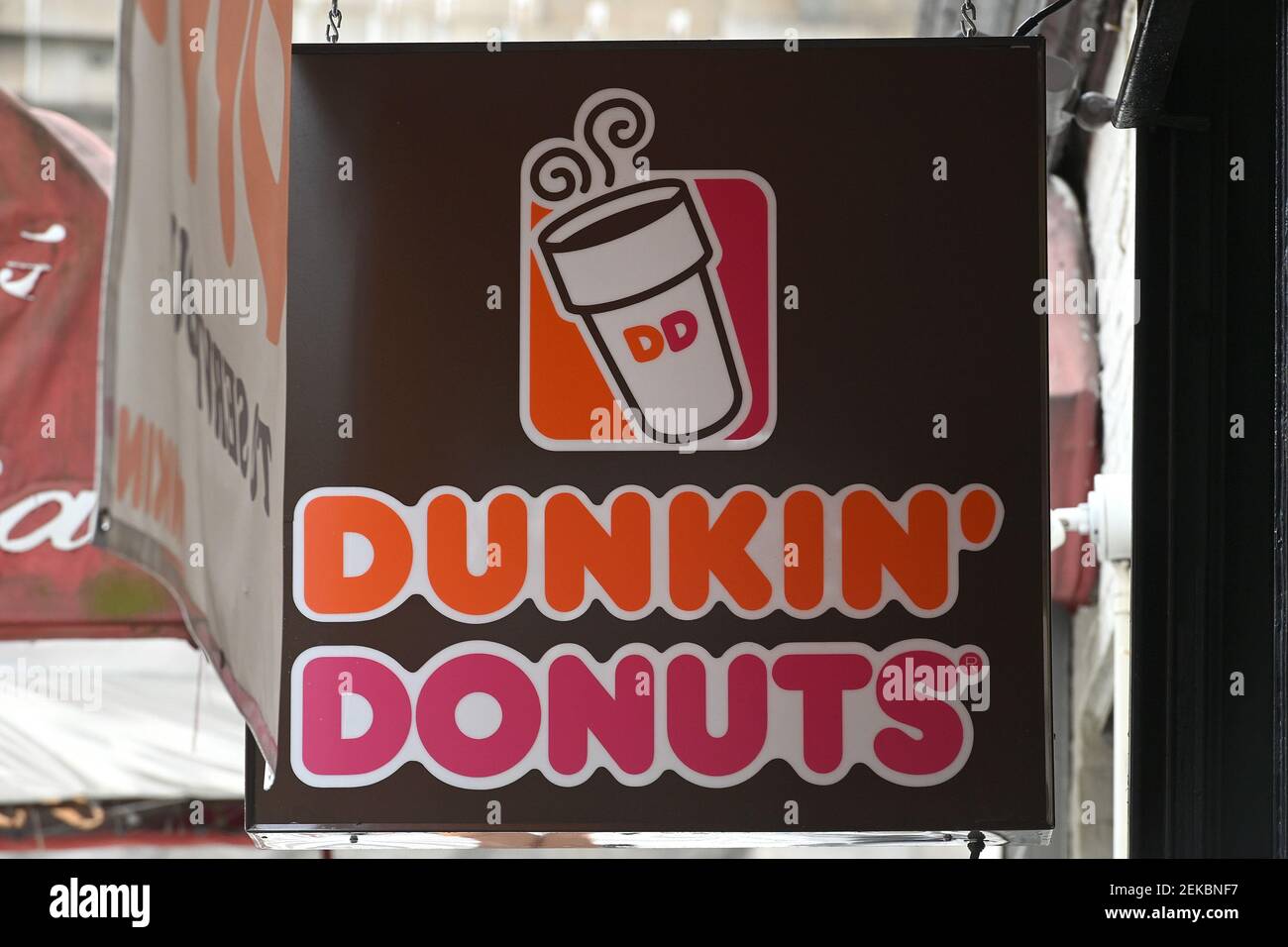 View of the Dunkin’ Donuts logo outside a Manhattan store, as the