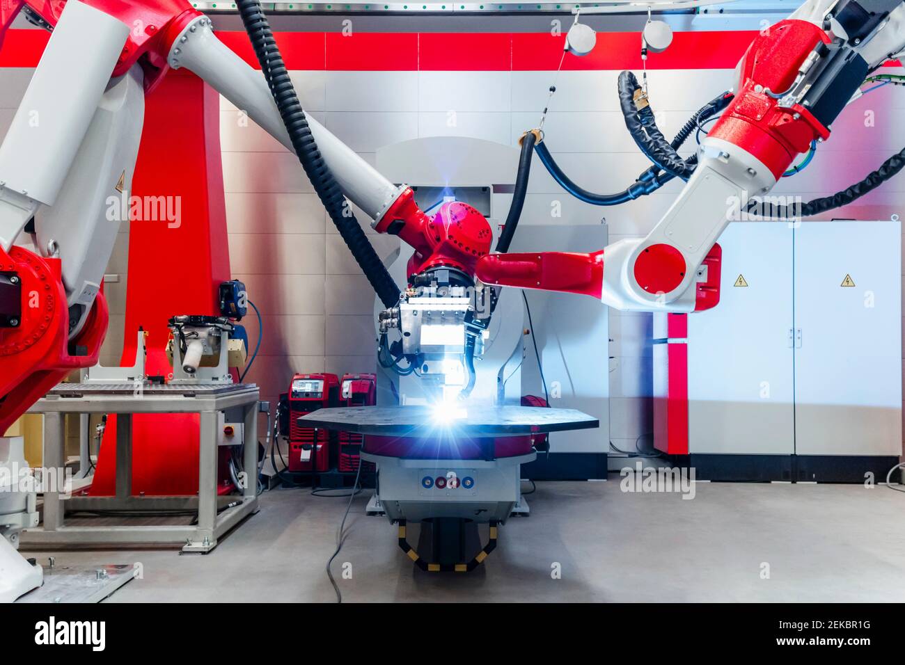 Automatic robots welding metal in factory Stock Photo