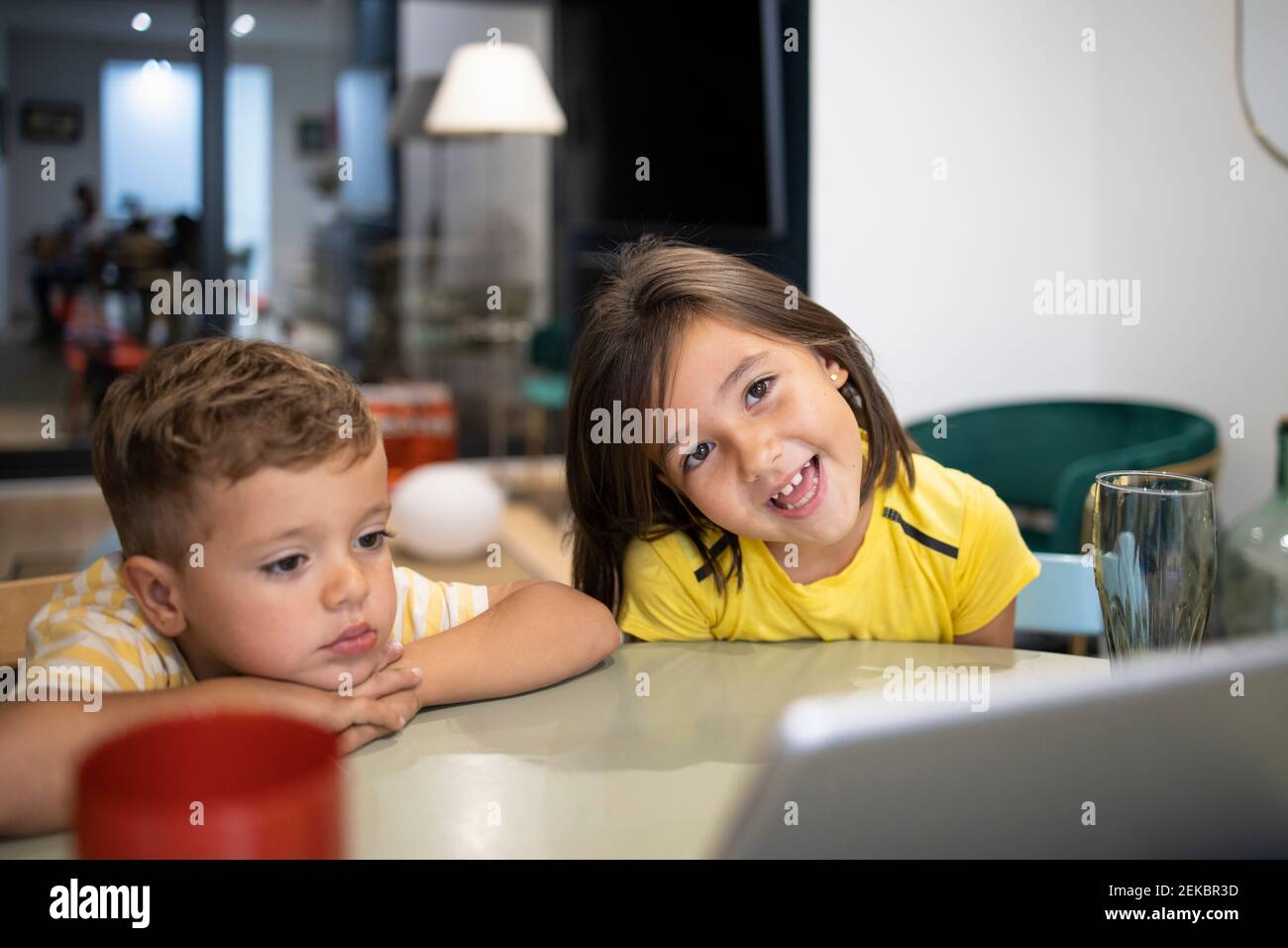 Boy girl sitting table hi-res stock photography and images - Alamy