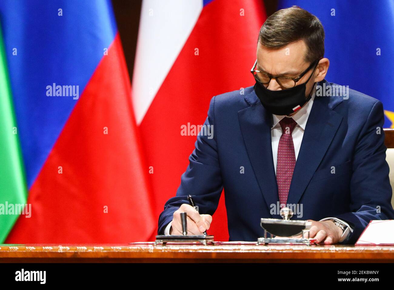 Polish Prime Minister Mateusz Morawiecki seen signing the documents.  Summit of Heads of Government of the Visegrad Group (V4) on the occasion of the Stock Photo