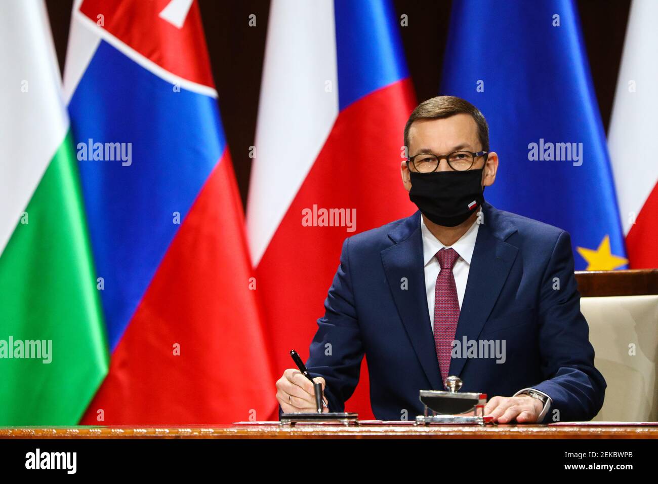 Polish Prime Minister Mateusz Morawiecki seen signing the documents.  Summit of Heads of Government of the Visegrad Group (V4) on the occasion of the Stock Photo