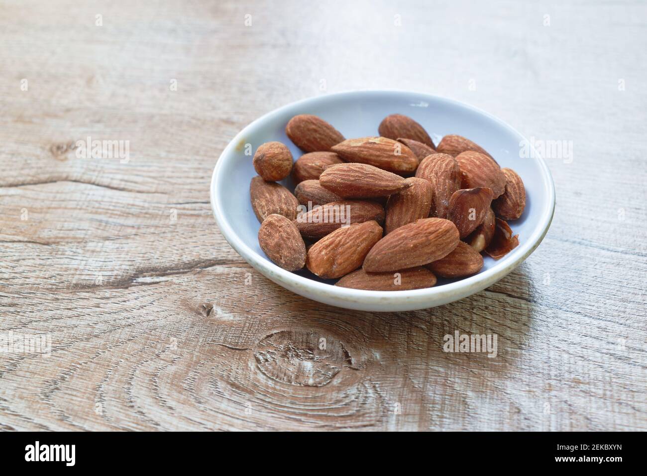 salty baked almond seed batch on cup Stock Photo