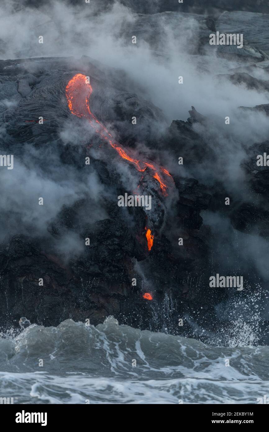 USA, Hawaii, HI, Lava river flowing into the Pacific Ocean from Kilauea