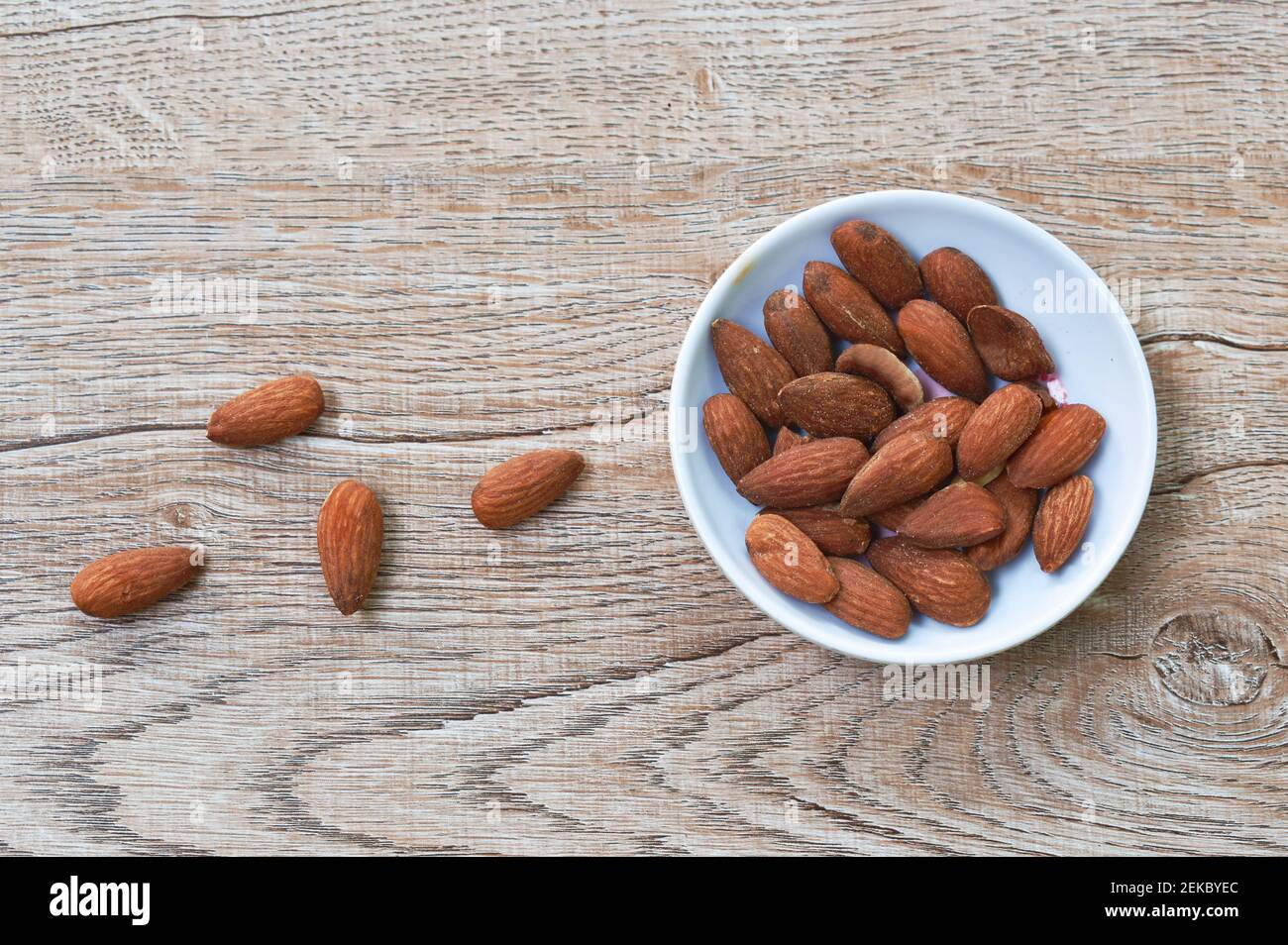 salty baked almond seed batch on cup Stock Photo