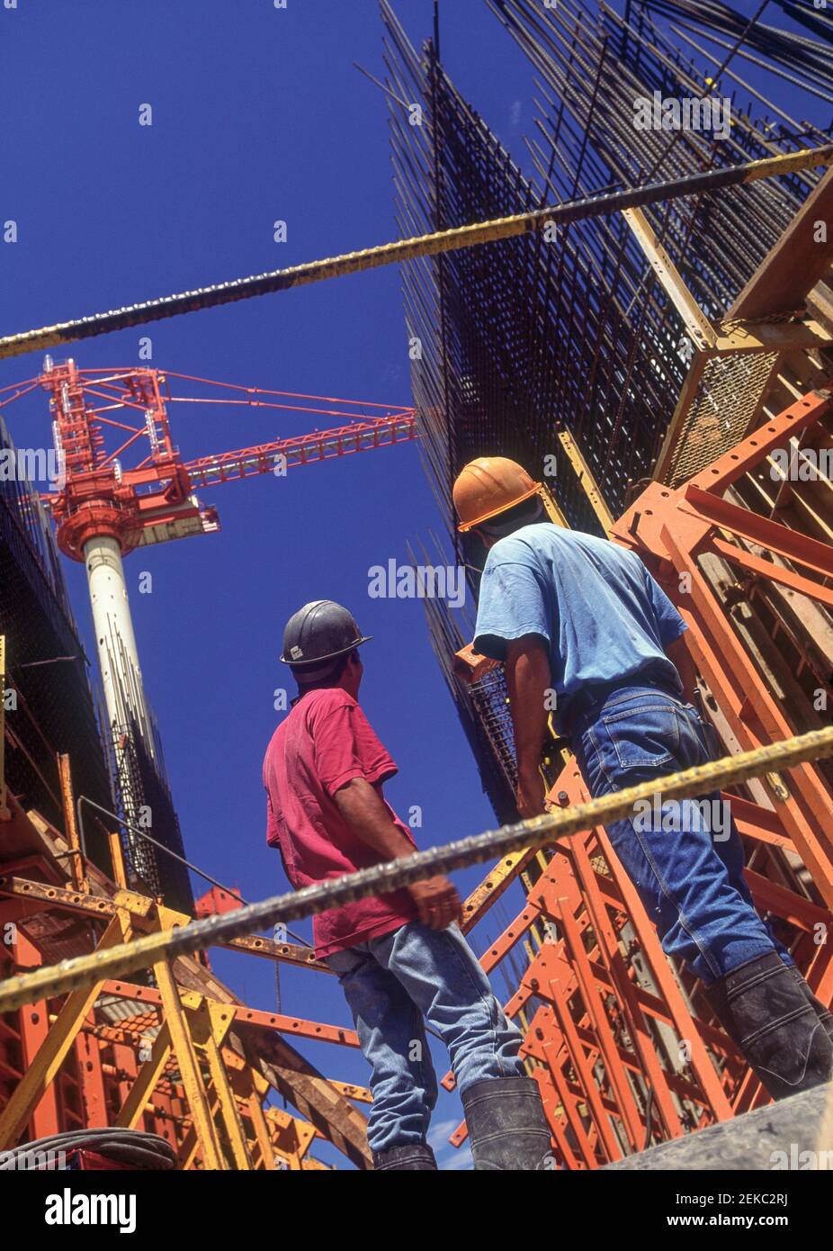 Workers standing at hydroelectric power dam construction site
