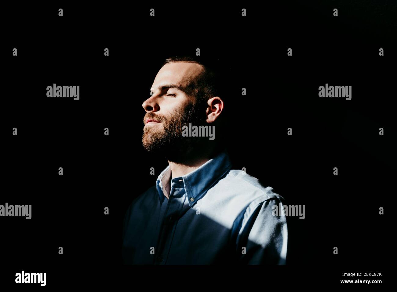 Young man standing profile hi-res stock photography and images - Alamy