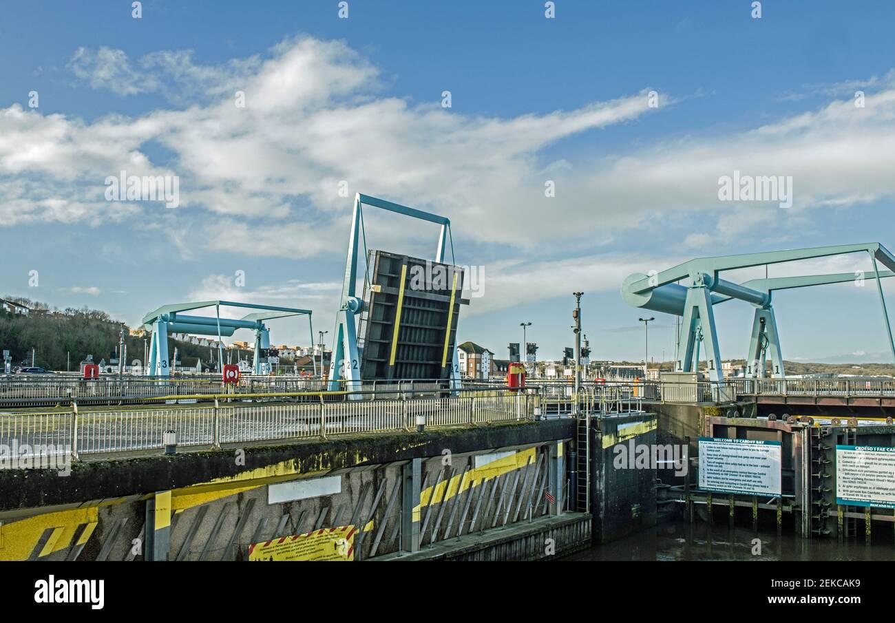 The Cardiff Bay Barrage with one of the bascule bridges raised Cardiff. Stock Photo