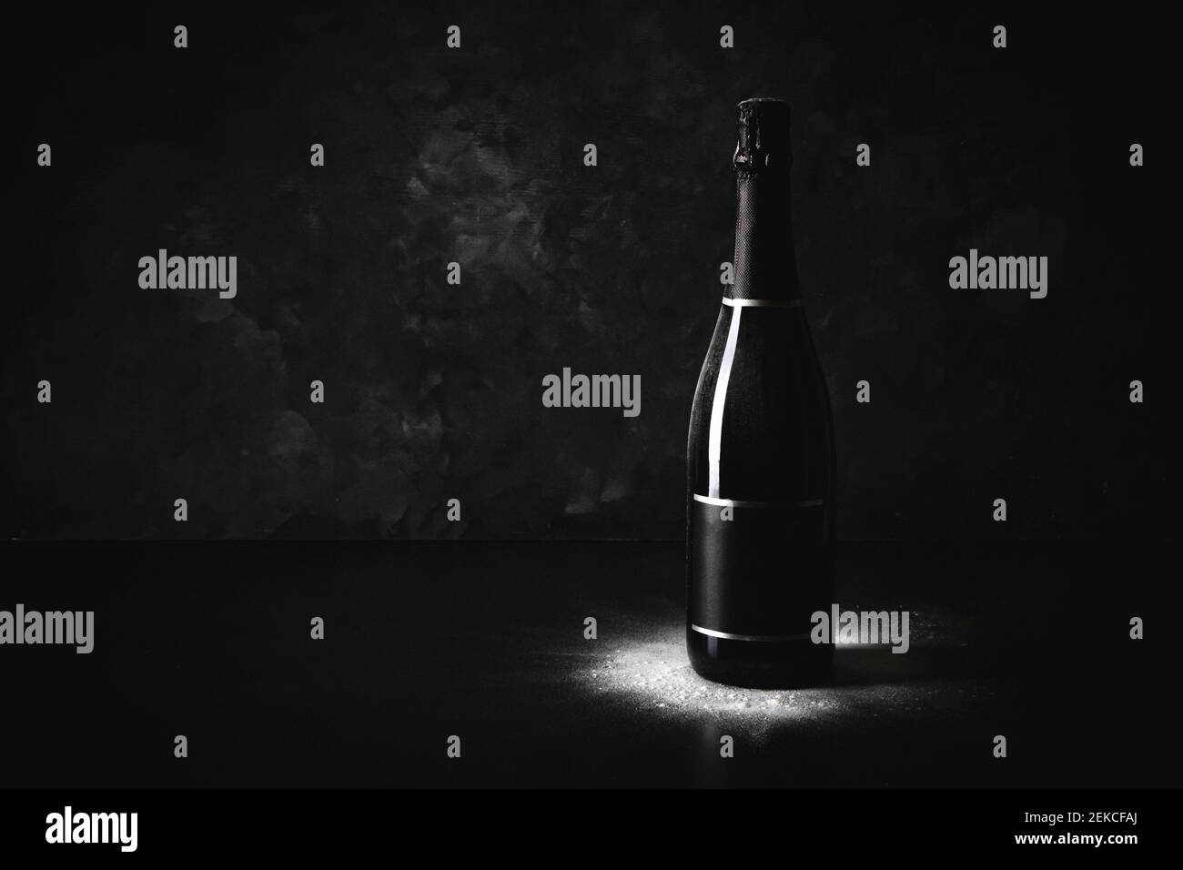 Studio shot of black bottle of champagne with blank label Stock Photo