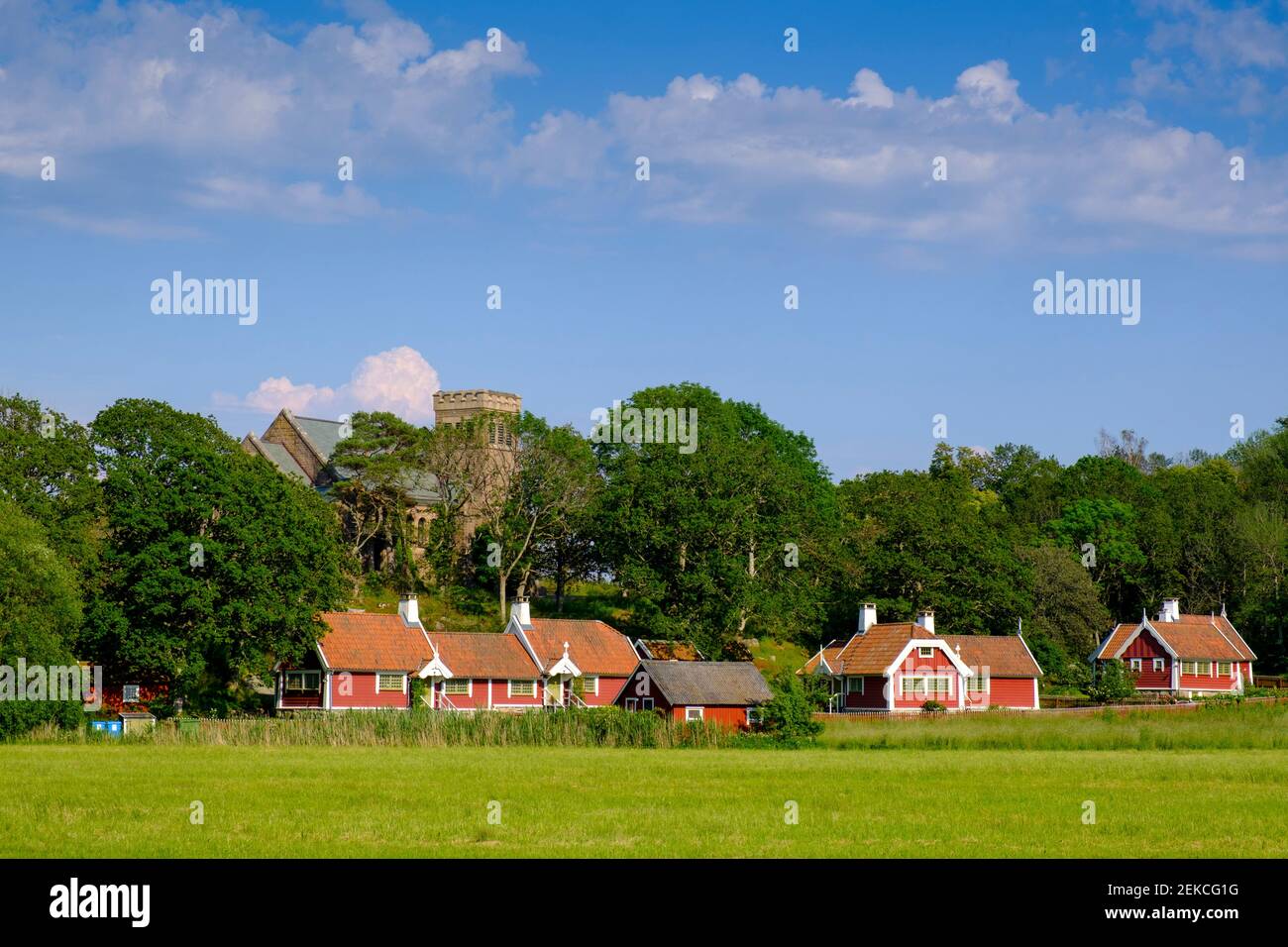 Sweden, Halland County, Kungsbacka Municipality, Rustic houses in front of Tjoloholm Castle Stock Photo