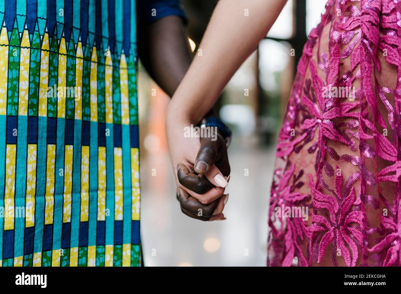 Young couple holding hands while standing at banquet Stock Photo