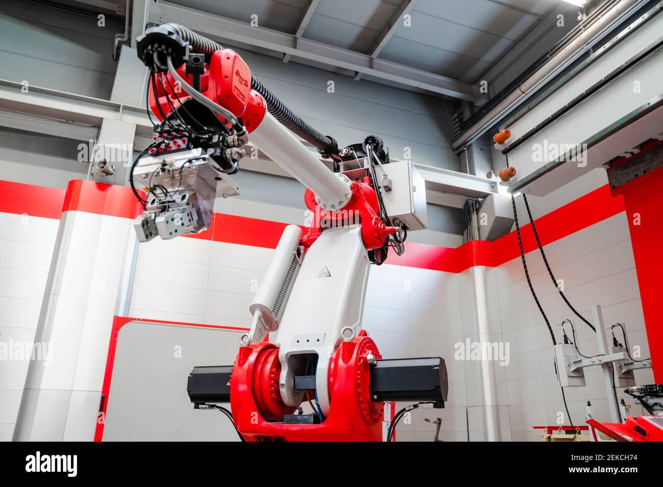 Low angle view of industrial welding robot arm in factory Stock Photo