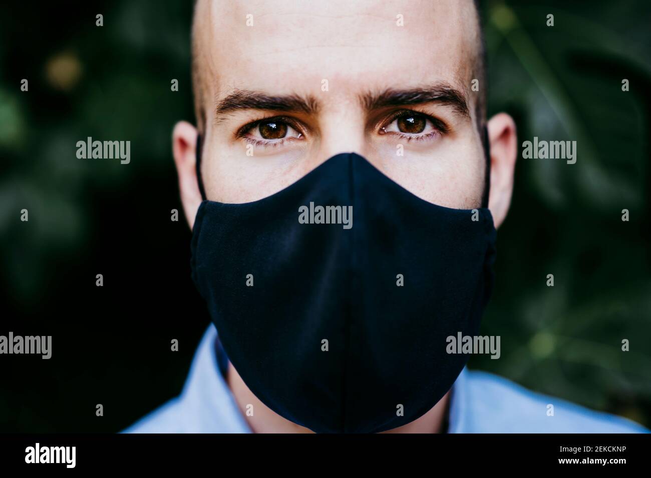 Young man wearing protective mask Stock Photo