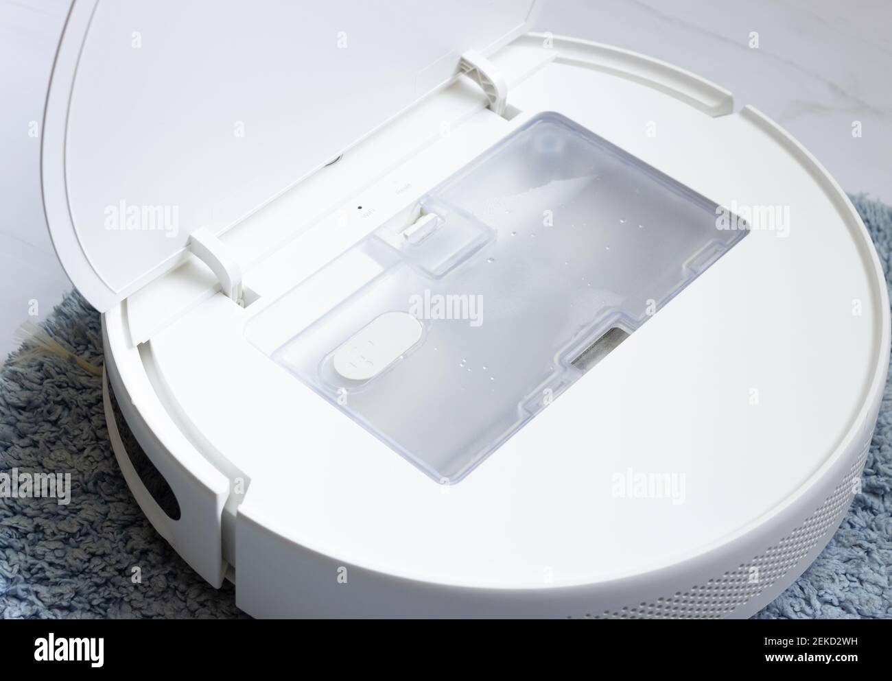 Outdoor white robot vacuum Cleaner, dust collection container. Home