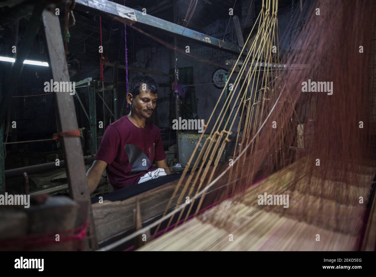 Md Irshad, a handloom weaver weaves Banarasi saree on a traditional ...