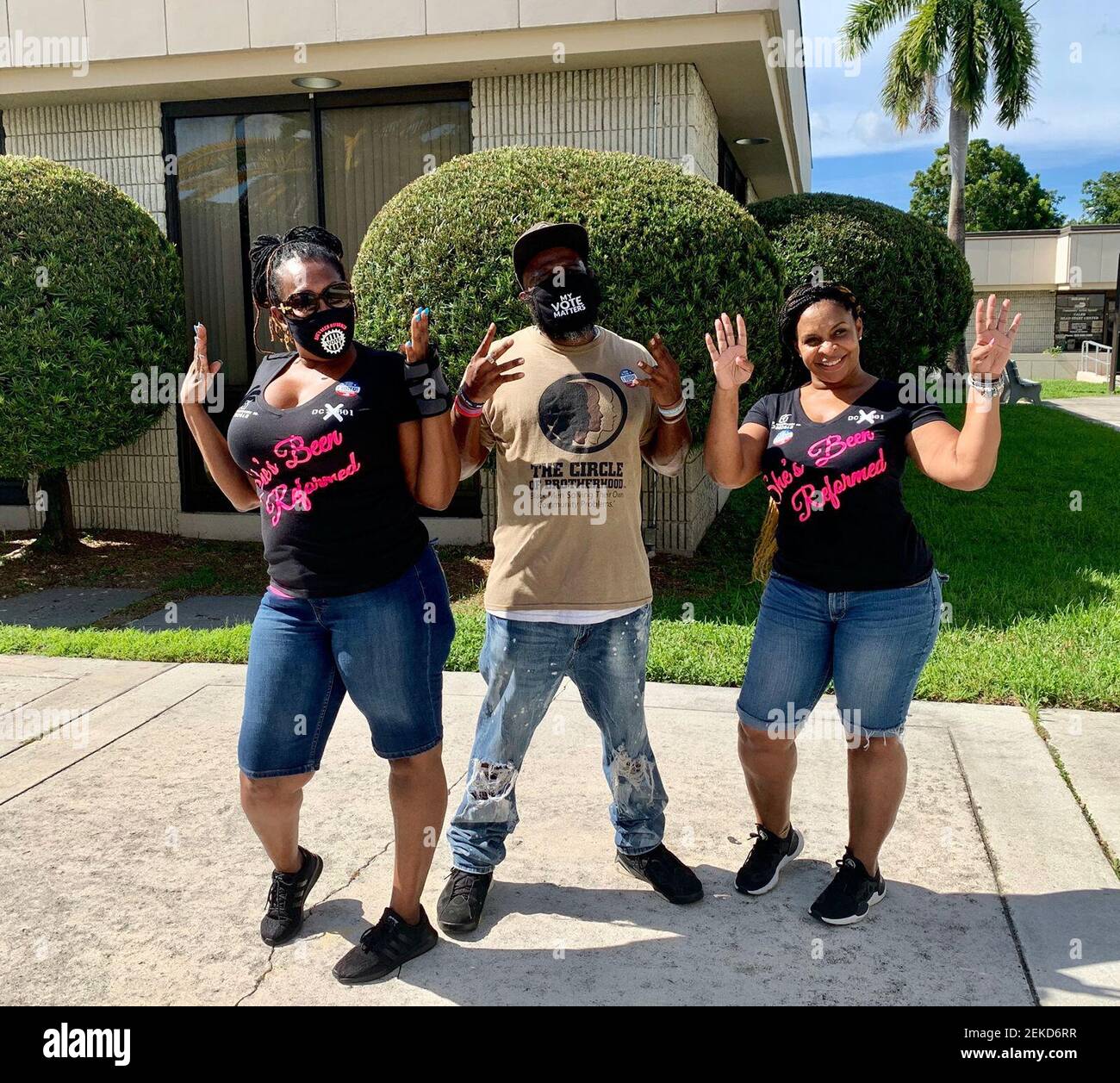 From left, Tabatha Bailey, Ijamyn Gray and Deshaun Jones pose for a photo  after voting in Miami Tuesday, August 11, 2020. Each threw up "fours" in  honor of Amendment 4, a measure