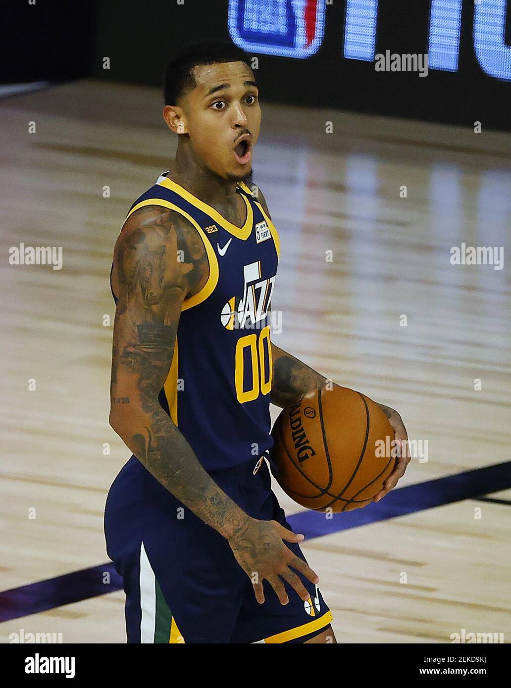Aug 13, 2020; Lake Buena Vista, Florida, USA; Jordan Clarkson #00 of the  Utah Jazz reacts to a call by the officials during the second quarter  against the San Antonio Spurs at